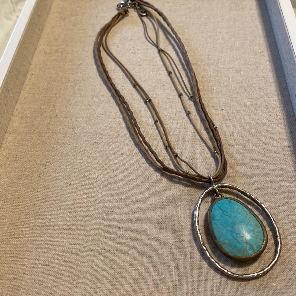 Turquoise and Silver pendant on 4 strand rope . 16” with 2” extender